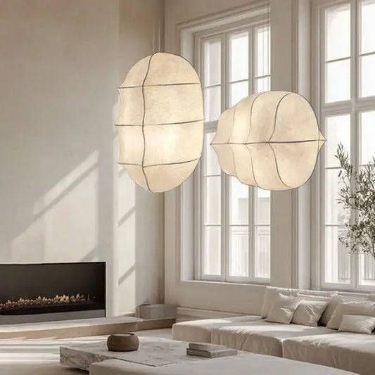 Japanese Wabi-Sabi Silk Pendant Light – Sculptural White Hanging Lamp in a bright living room setting.