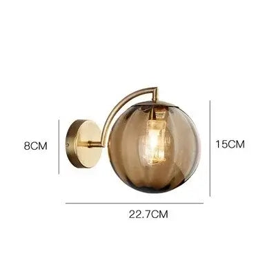 Colourful Glass Modern Wall Light with golden metal base and transparent bulb, ideal for indoor decor.