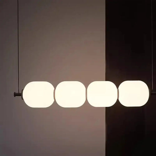 Modern Diffused Light Strip Pendant | Elegant Lighting Solution featuring four soft-lit spheres in an elegant design.
