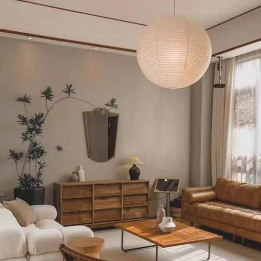 Japanese Rice Paper Pendant Lights illuminating a stylish living room with modern decor and natural elements.
