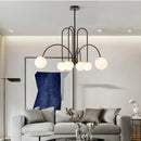 Modern Magic Beans 4-Head Gold LED Chandelier – Sophisticated Ceiling Light in elegant living room setting.