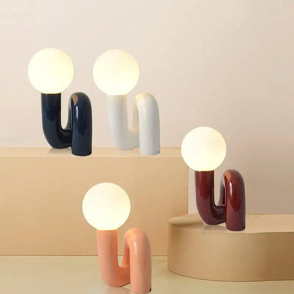 Sculptural Resin Table Lamp – Italian-Inspired Modern Lighting showcasing a variety of colors and soft ambient lighting.