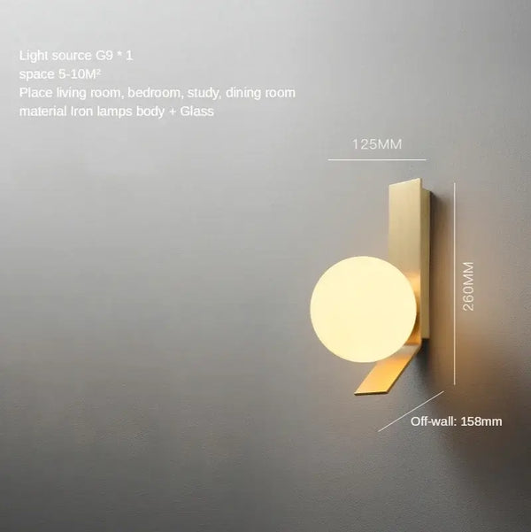 Contemporary Golden Wall Lamp with Glass Ball featuring a modern design and unique wrought iron angle for stylish interiors.