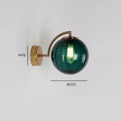 Colourful Glass Modern Wall Light featuring a green glass globe and golden metal base for stylish home decor.