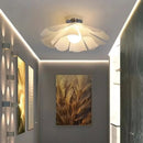 Nordic Simple Chandelier illuminating a stylish hallway with soft, diffused light and sleek design.