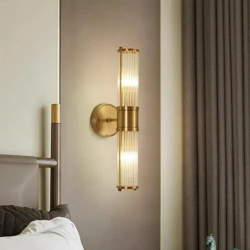 Bathroom Art Deco Brass and Crystal Sconces illuminating a modern bathroom with elegant design.