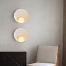 Sleek Resin Wall-Mounted Bathroom Light with frosted glass, illuminating a modern interior space.