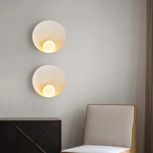 Sleek Resin Wall-Mounted Bathroom Light with frosted glass, illuminating a modern interior space.