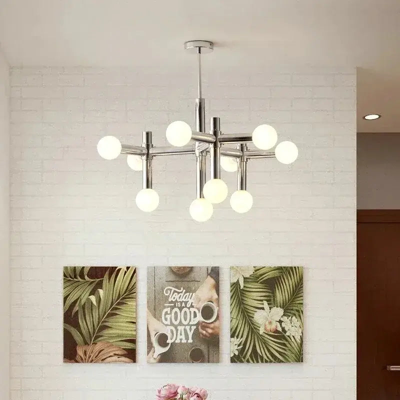 Bauhaus Chrome Chandelier – Modern 10/13 Globe Pendant Light hanging in a stylish interior with white walls.