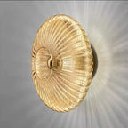 Radiant Modern Glass Wall Lamp with elegant ribbed glass design in amber color, showcasing a warm light effect.