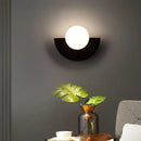 Halfmoon Metal Sconce. Comes in 2 different sizes and various colours. Modern Nordic design with clear glass shade.