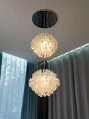 70s Retro Shell Multi-String Light Pendant illuminating a modern interior with luxurious shell accents.