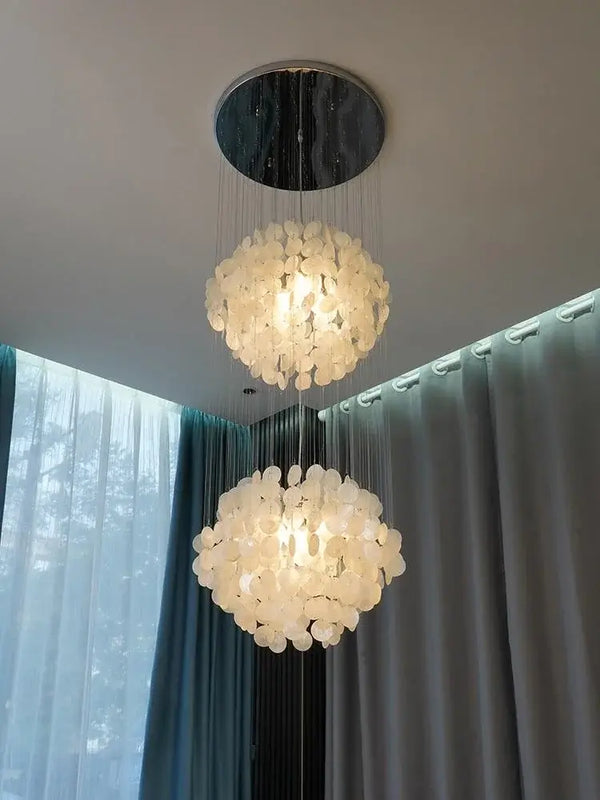 70s Retro Shell Multi-String Light Pendant illuminating a modern interior with luxurious shell accents.