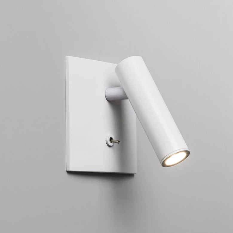 White wall-mounted light fixture on a gray background