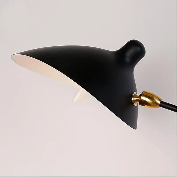 Swing Arm Nordic Loft Wall Lamp with a sleek black shade and gold accent, perfect for modern indoor spaces.