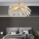 Nordic Feather Pendant Light – Art-Inspired Modern Ceiling Chandelier illuminating a stylish bedroom interior.