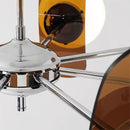 Rare Mid-Century Orange Plexiglass Chandelier: A Unique Vintage Gem with chrome frame and amber reflectors.