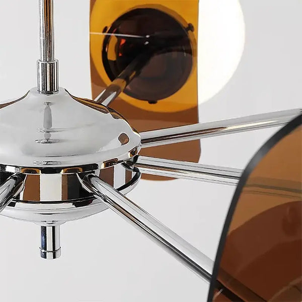 Rare Mid-Century Orange Plexiglass Chandelier: A Unique Vintage Gem with chrome frame and amber reflectors.