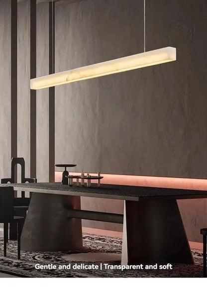 Natural Marble Linear Pendant Light 80–120cm illuminating a modern dining area with sleek minimalist design and integrated LED lighting.