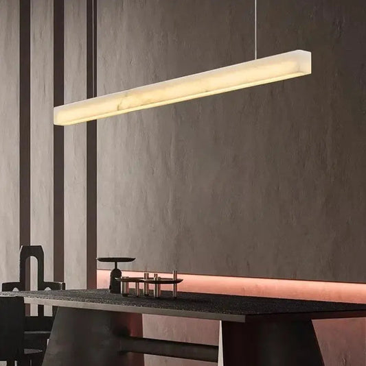Natural Marble Linear Pendant Light 80–120cm showcasing sleek design over a modern dining table.