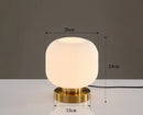 Modern Nordic Glass Table Lighting Fixtures with a sleek white glass shade and gold base, dimensions 20cm x 24cm.
