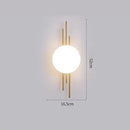 Modern Simple Art Deco Revival Wall Lamp with a spherical light and gold accents, 52cm height, 16.5cm width.