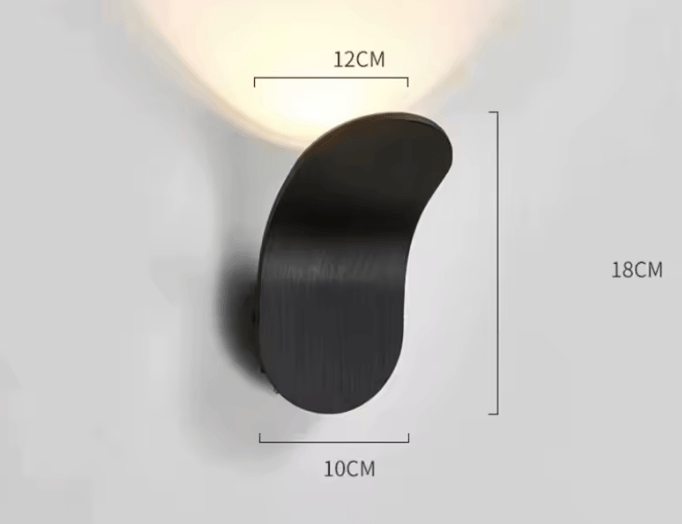 A curved wall-mounted light fixture in a dark brushed finish, shown with overlaid dimension labels reading 12CM, 10CM, and 18CM on a light gray background.