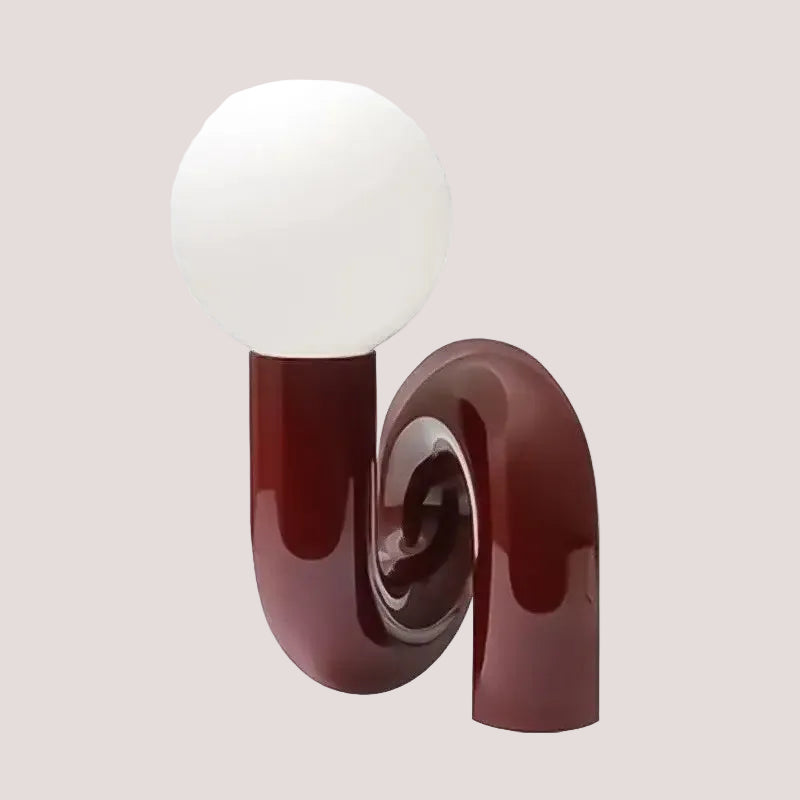 Sculptural Resin Table Lamp – Italian-Inspired Modern Lighting featuring a curvy design and frosted glass globe.