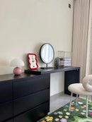Mushroom LED USB Table Lamp in Pink – Soft Glow Bedside Lighting on a modern black dresser, adding charm and warmth.
