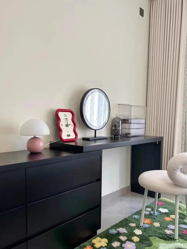 Mushroom LED USB Table Lamp in Pink – Soft Glow Bedside Lighting on a modern black dresser, adding charm and warmth.