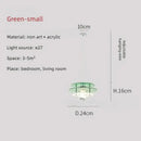 Space Age Acrylic Colorful Pendant Light with green acrylic disks and adjustable hanging wire.