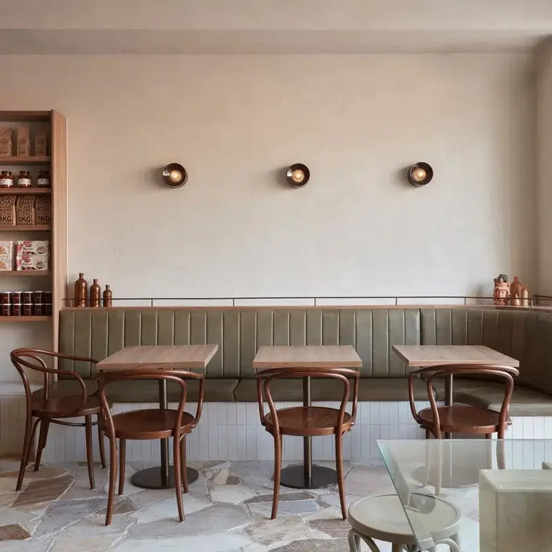 Bauhaus Round Metal Wall Lamp Paint Black/white 15cm/18cm Wall Light for Home Living Room Dining Room Bedroom LED Lighting in a stylish café.