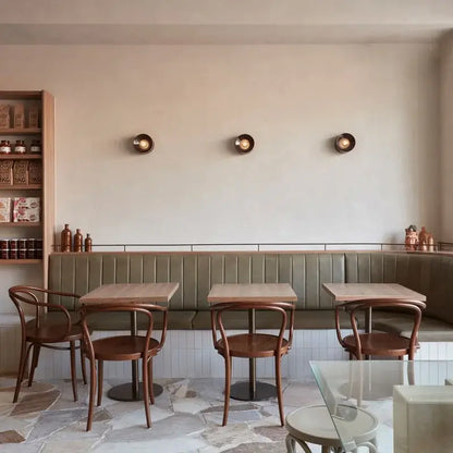 Bauhaus Round Metal Wall Lamp Paint Black/white 15cm/18cm Wall Light for Home Living Room Dining Room Bedroom LED Lighting in a stylish café.