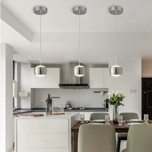 French Nouvelle Vague Pendant Light illuminating a modern kitchen with minimalist design and stylish decor.