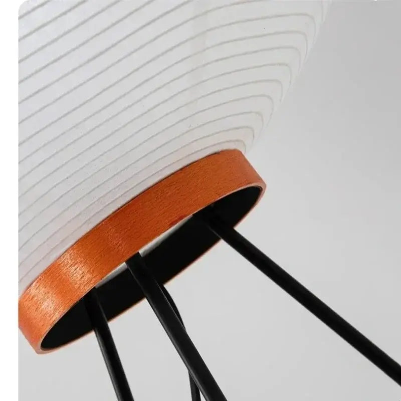 Close-up of Japanese Rice Paper Table Lamp showcasing its bamboo and black metal design.