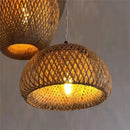 Chic Mid-Century Rattan Chandeliers showcasing woven rattan design with soft light illuminating the room.