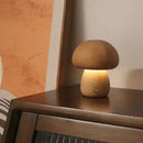 Portable Dimmable 60s Italy Designer Mushroom Table Lamp on a wooden surface with warm light.