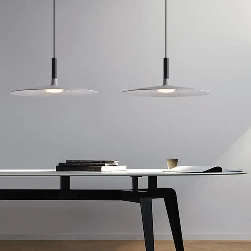 Sleek, Modern Led Pendant Lamps illuminating a stylish workspace with a minimalistic design.