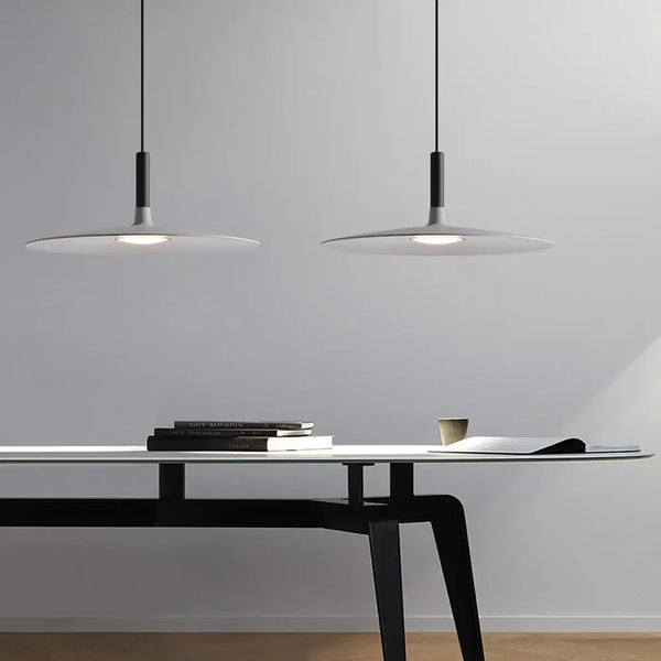 Sleek, Modern Led Pendant Lamps illuminating a stylish workspace with a minimalistic design.