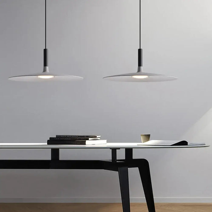 Sleek, Modern Led Pendant Lamps illuminating a stylish workspace with a minimalistic design.