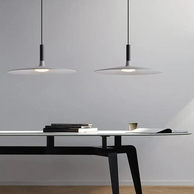 Sleek, Modern Led Pendant Lamps illuminating a stylish workspace with a minimalistic design.