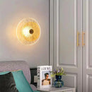Art Deco Flower Wall Light illuminating a stylish living room with a cozy atmosphere.