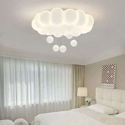 Modern bedroom with cloud-shaped ceiling light fixture