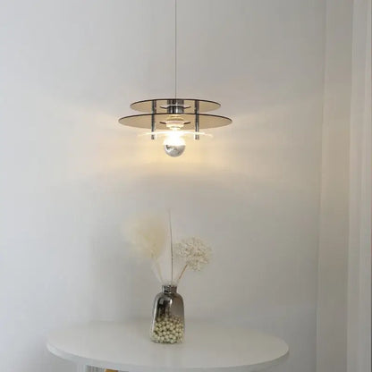 Space Age Acrylic Colorful Pendant Light illuminating a dining area with vibrant colors and stylish design.