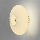 Radiant Modern Glass Wall Lamp featuring an elegant ridged design in frosted white for stylish illumination.