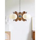 Rare Mid-Century Orange Plexiglass Chandelier: A Unique Vintage Gem showcasing oval orange reflectors and white frosted glass balls.