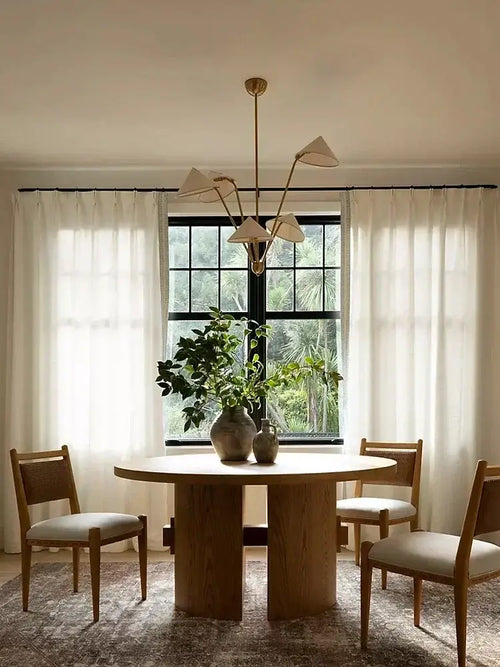 Chic Japansese Mid-Century Modern Ceiling Pendant illuminating a stylish dining area with natural light.