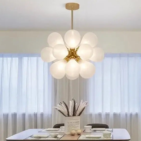 Glorious Tinted Glass Bubble Chandelier hanging in a modern dining room with elegant decor.