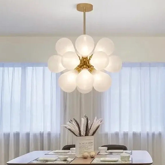 Glorious Tinted Glass Bubble Chandelier hanging in a modern dining room with elegant decor.