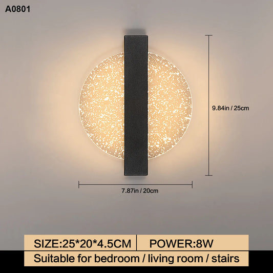 A modern wall sconce with a circular textured glass shade and a vertical matte black metal bar, shown with dimension markings (7.87 in width and 9.